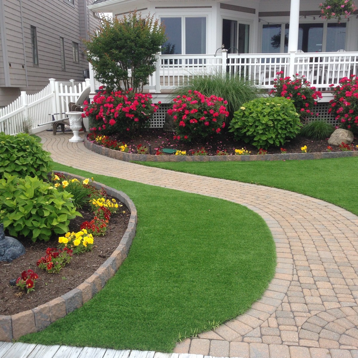 Artificial grass with sidewalk.